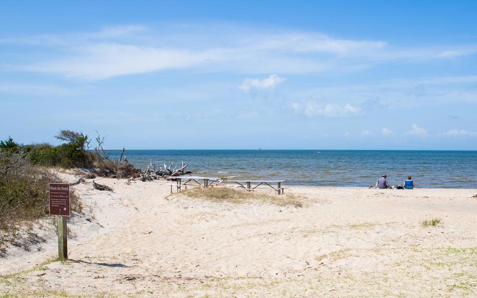 Lovely view of the sound from the Salvo Day use area white sand beach with sign