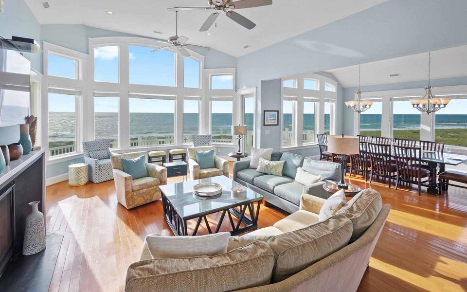 Interior of one of our most premier vacation homes with lots of windows facing the ocean 