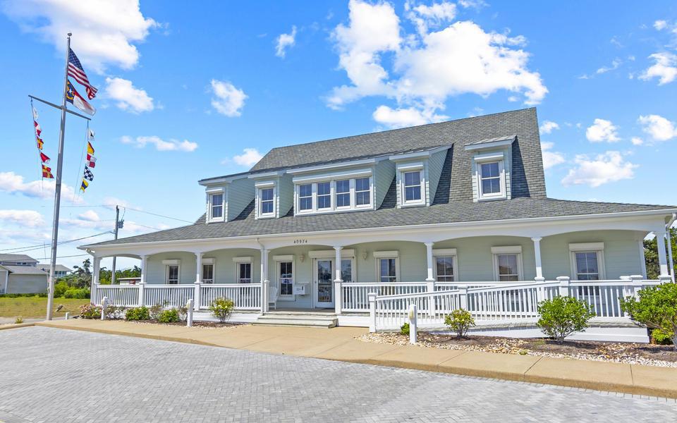 Our beautiful office & workplace in Avon. Traditional coastal architecture with dormers, cedar shakes, and a wide front porch