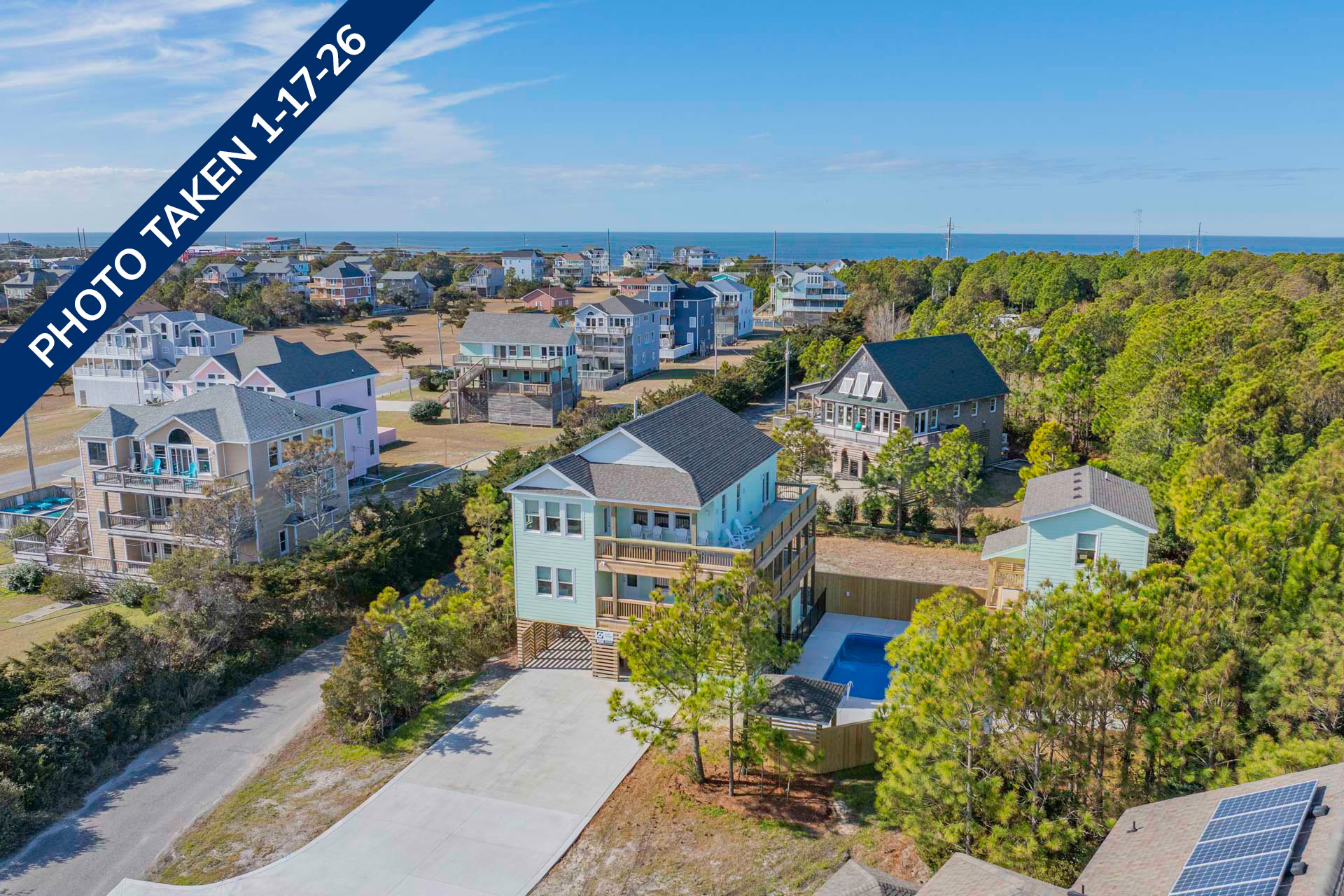 Surf Or Sound Realty 1240 Coastal Breeze Exterior 4 Date