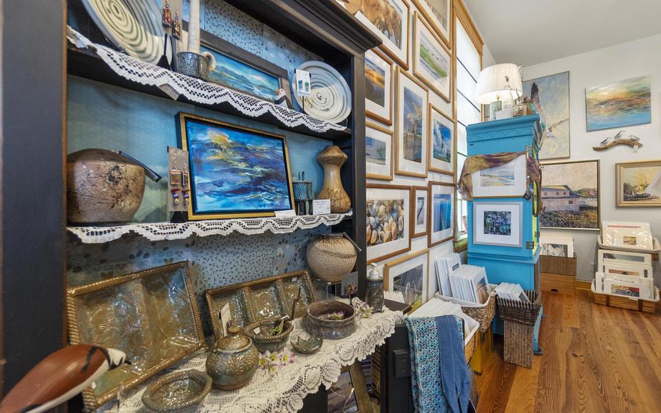 Framed art and pottery cover the walls and line the shelved inside this boutique. Great shopping on Hatteras Island.