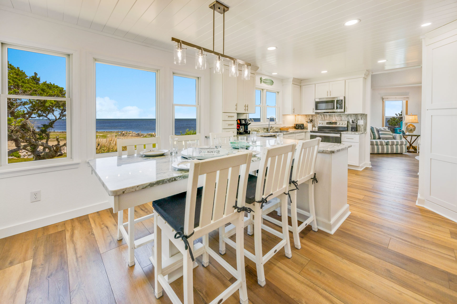Surf Or Sound Realty 905 Paradise Point Dining Area 2